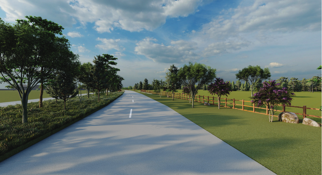 A paved road flanked by grass, trees, and wooden fences on both sides stretches into the distance under a partly cloudy sky near Richmond in Fort Bend County.